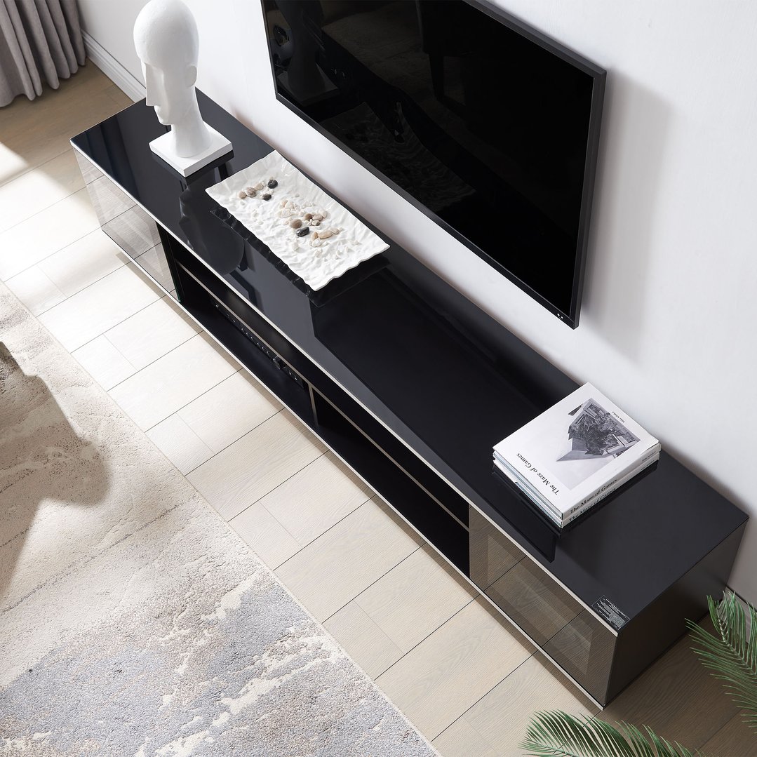 Overhead view of a black tv cabinet with a TV and decor in a living room