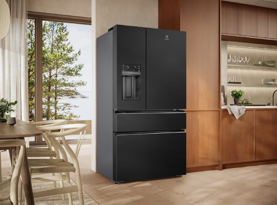 Black French Door Fridge in a modern kitchen with dining area and outdoor view