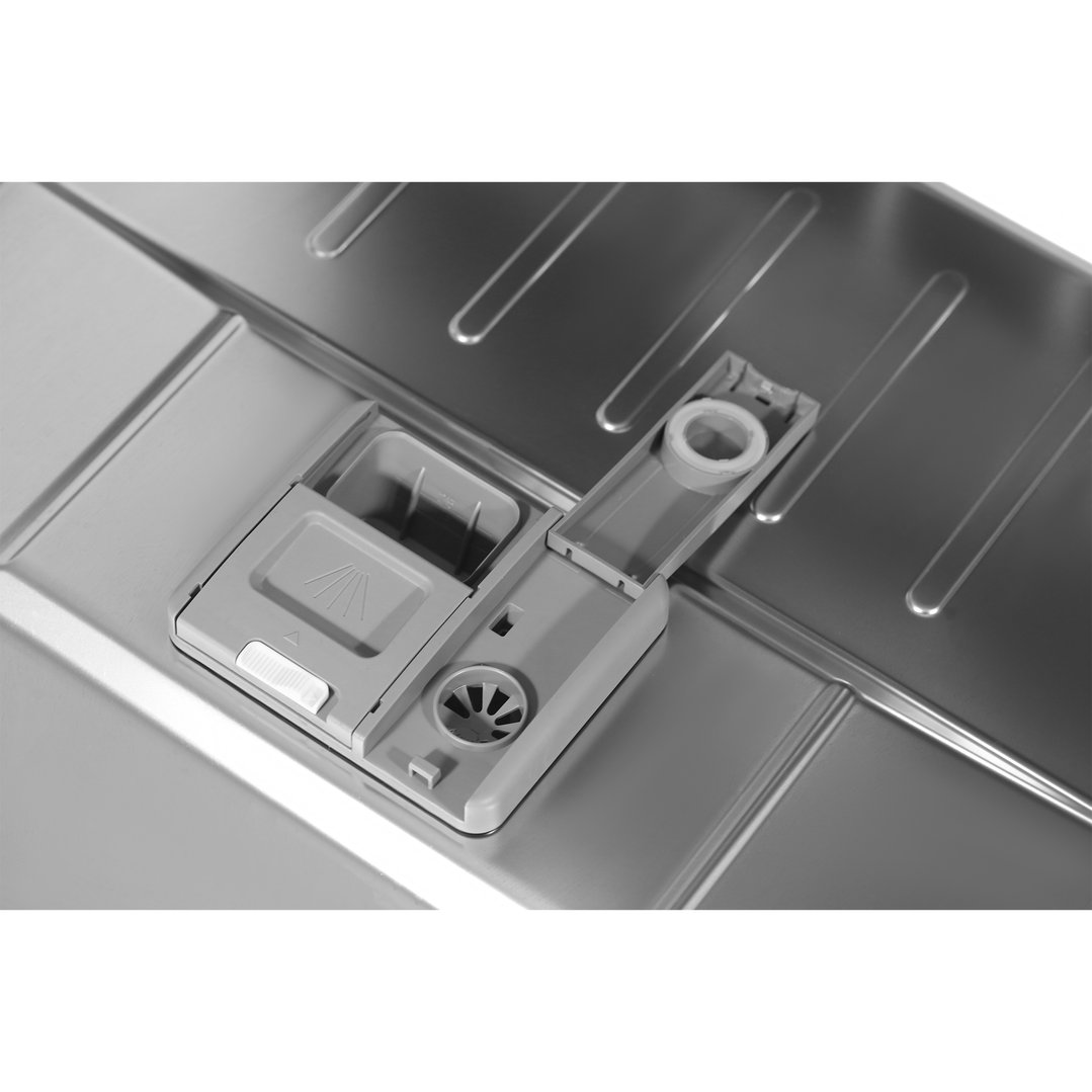 Close up of the open detergent dispenser inside a dishwasher