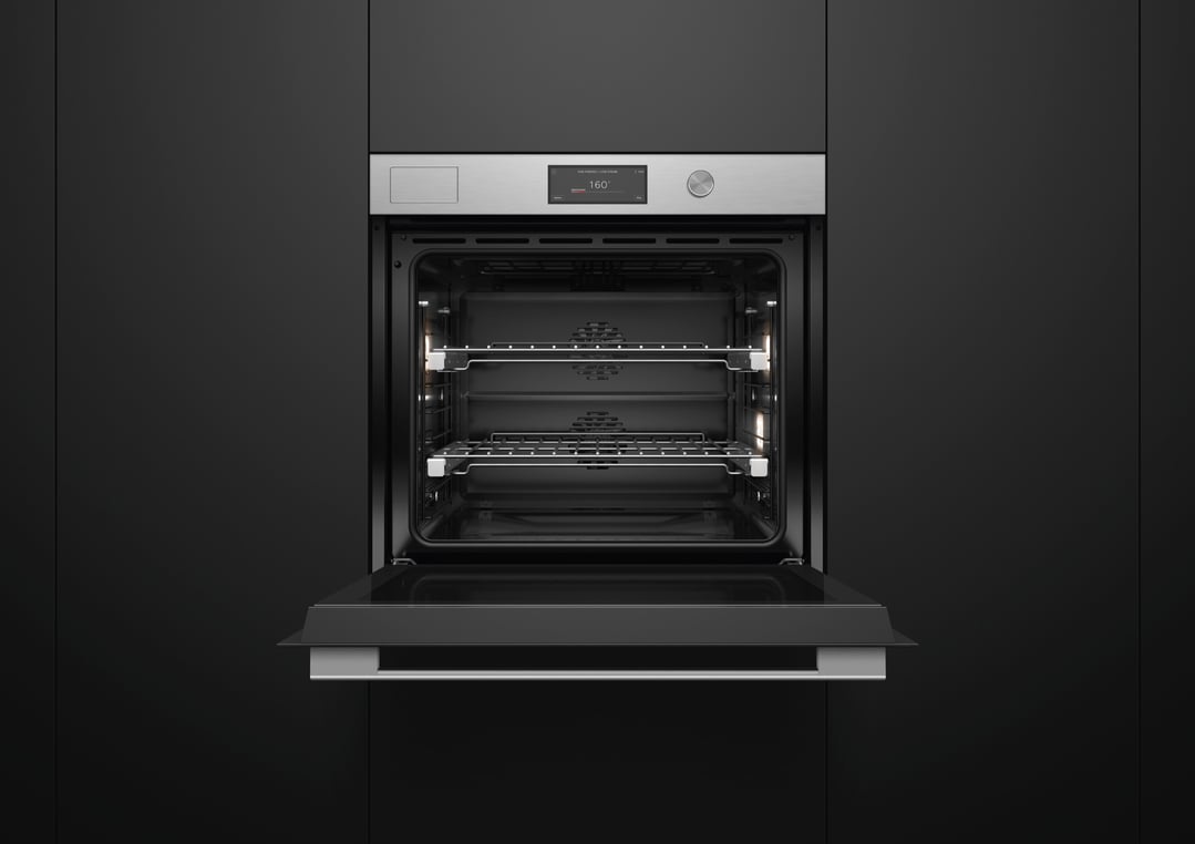 Open oven with illuminated interior and digital display showing 160 degrees