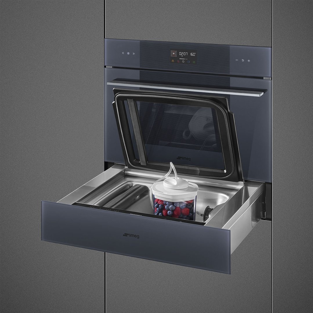 Built-in vacuum drawer with a container of berries and a vacuum pump
