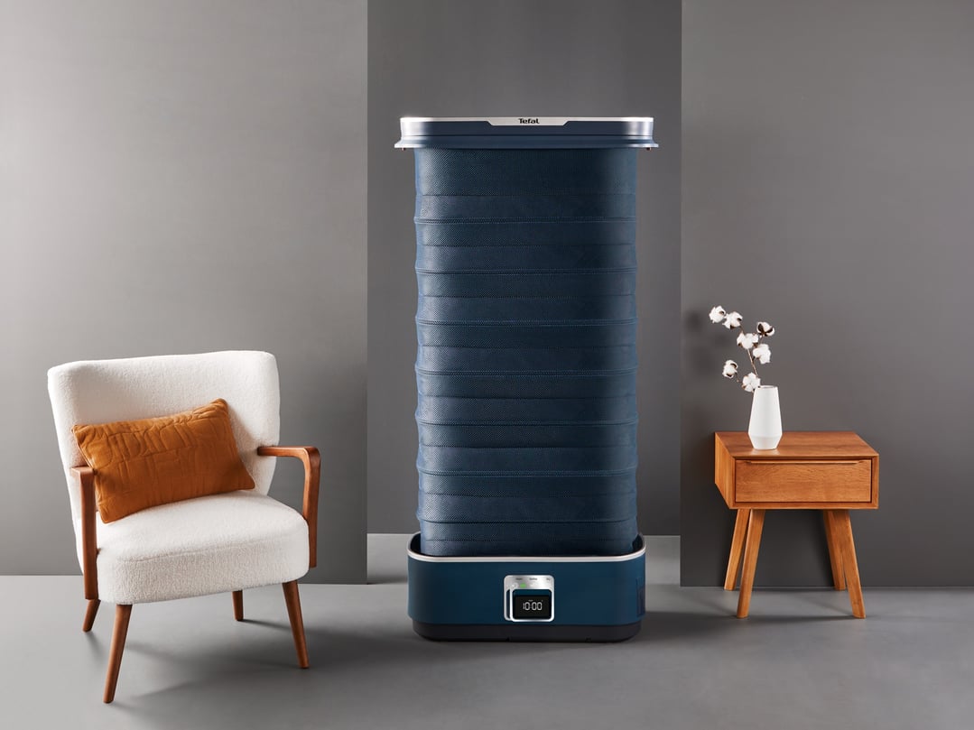 Tefal Care For You Automatic Garment Steamer in a modern living room setting