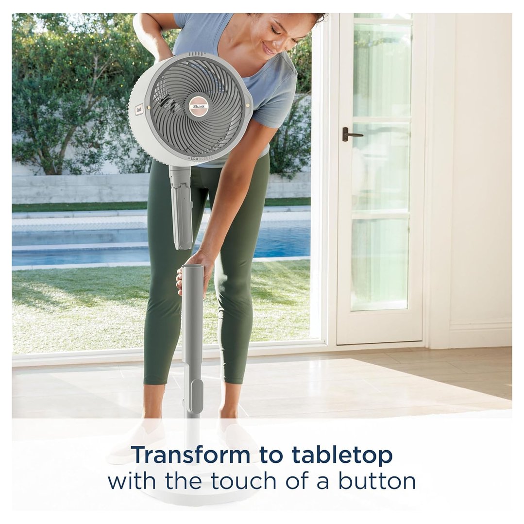 Woman transforming a Shark FlexBreeze fan from pedestal to tabletop mode indoors