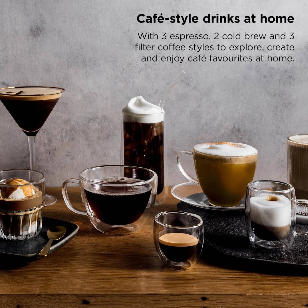 Various coffee drinks in different glasses on a wooden table with a grey background