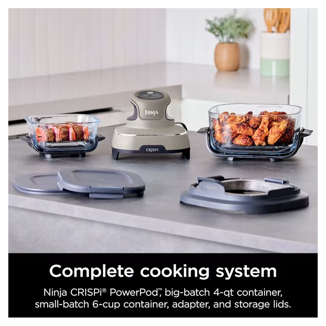 Ninja Crispi air fryer system with food in containers on a kitchen counter