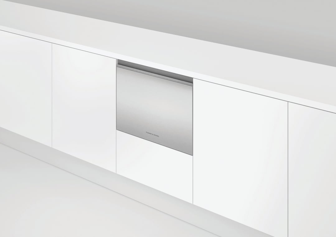 Stainless steel DishDrawer dishwasher integrated into white kitchen cabinetry