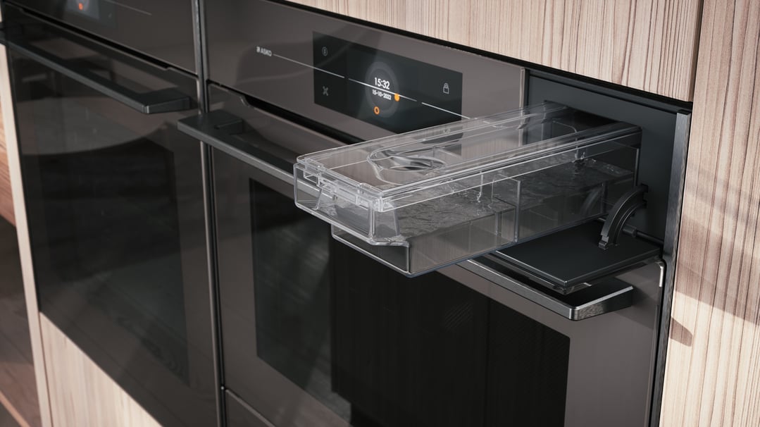 Close up of a built-in ASKO microwave oven with the water tank pulled out