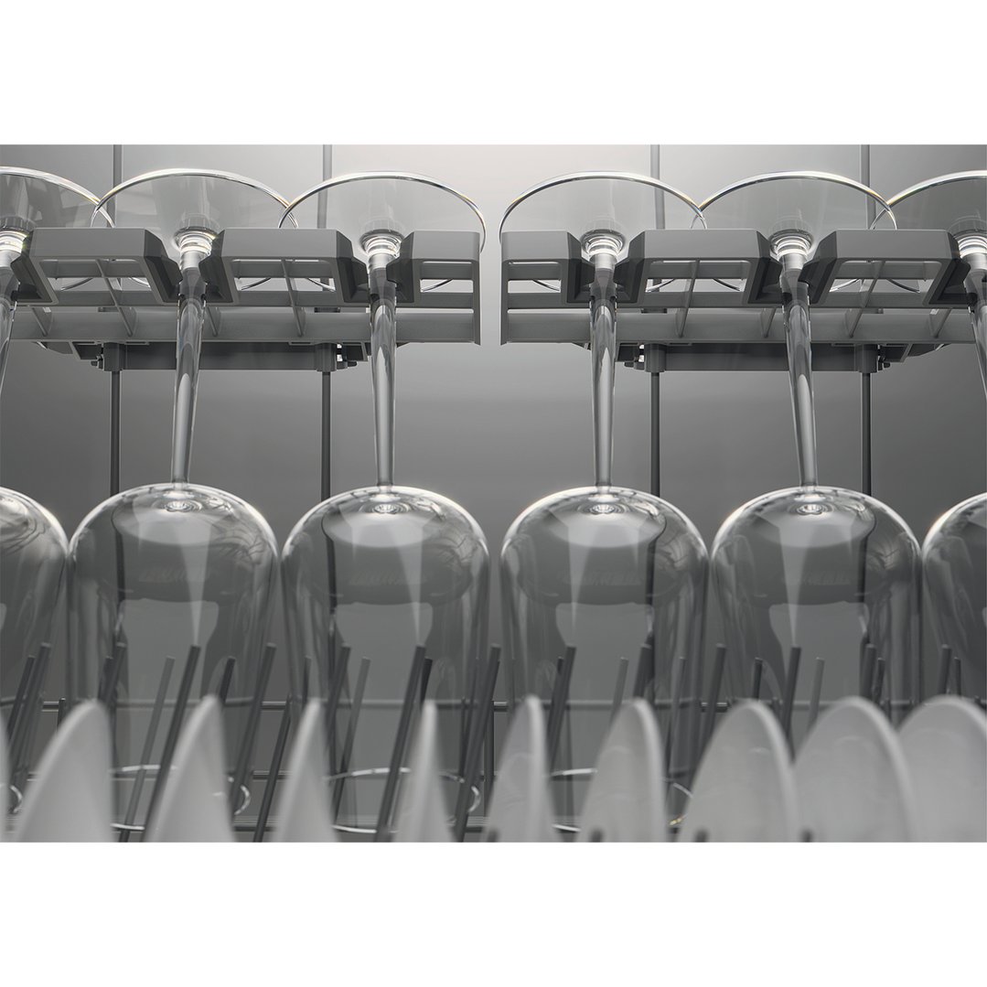 Wine glasses and plates in a dishwasher rack