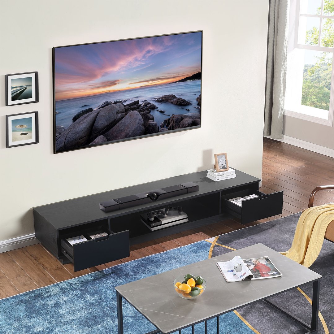 A black oak TV cabinet with a TV and soundbar in a living room