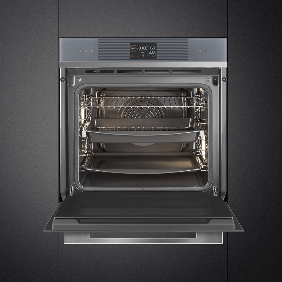 Built-in SMEG oven with door open, showing interior racks and trays