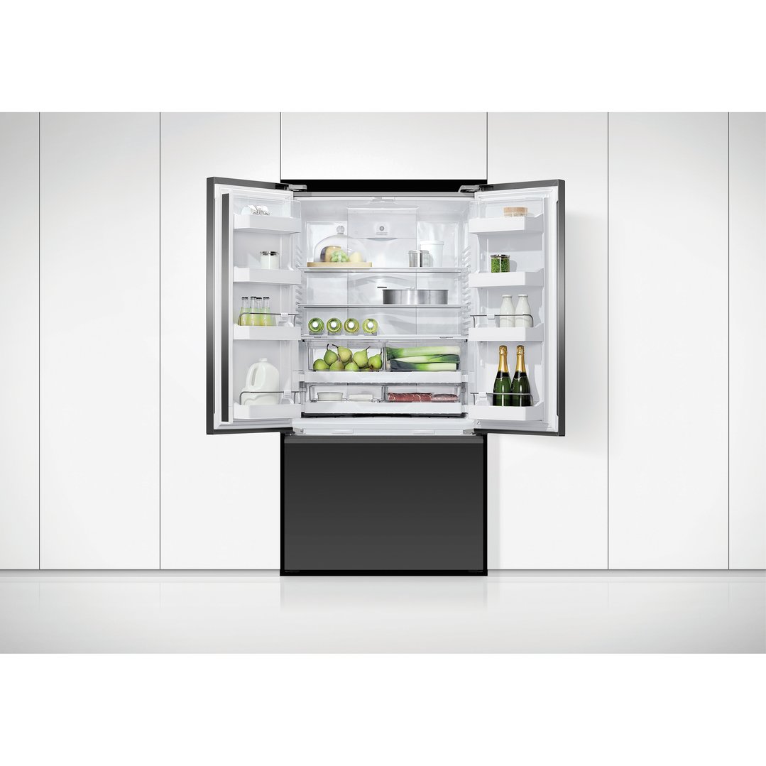 Open French door refrigerator freezer with food and drinks inside, in a kitchen
