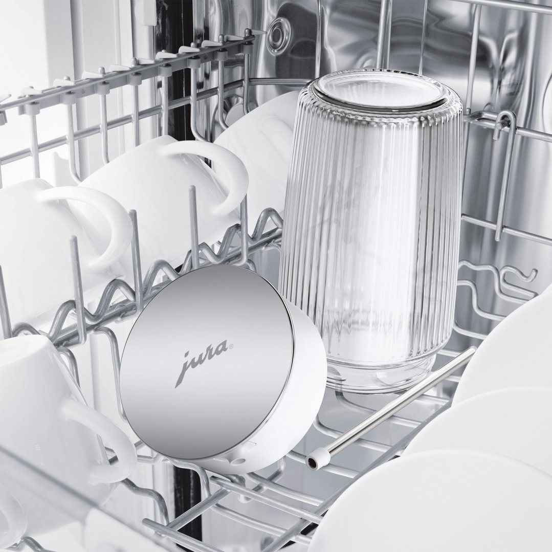 JURA Milk Carafe and other dishes in a dishwasher rack