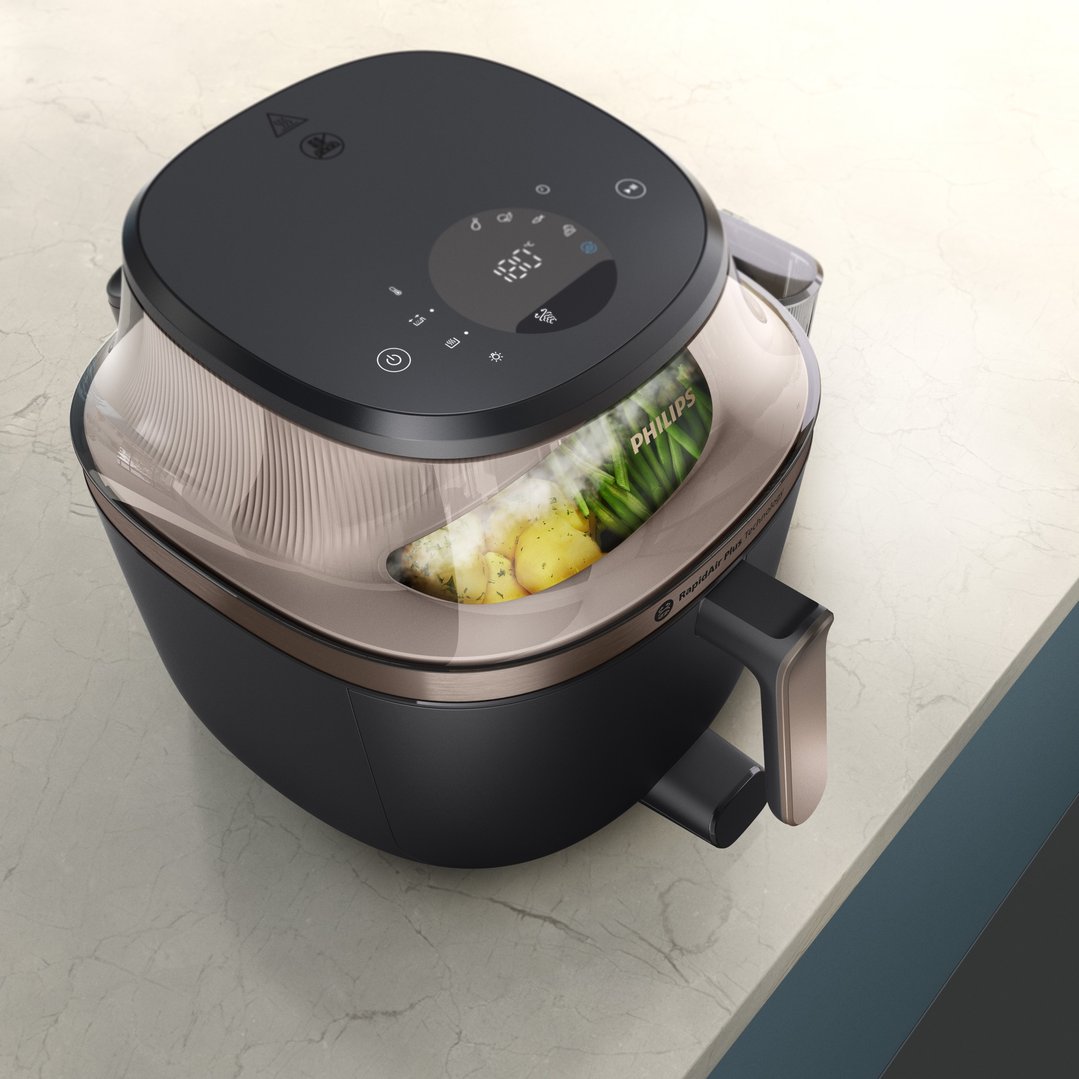 Philips 5000 Series Airfryer XXL Steam on a kitchen counter with food inside