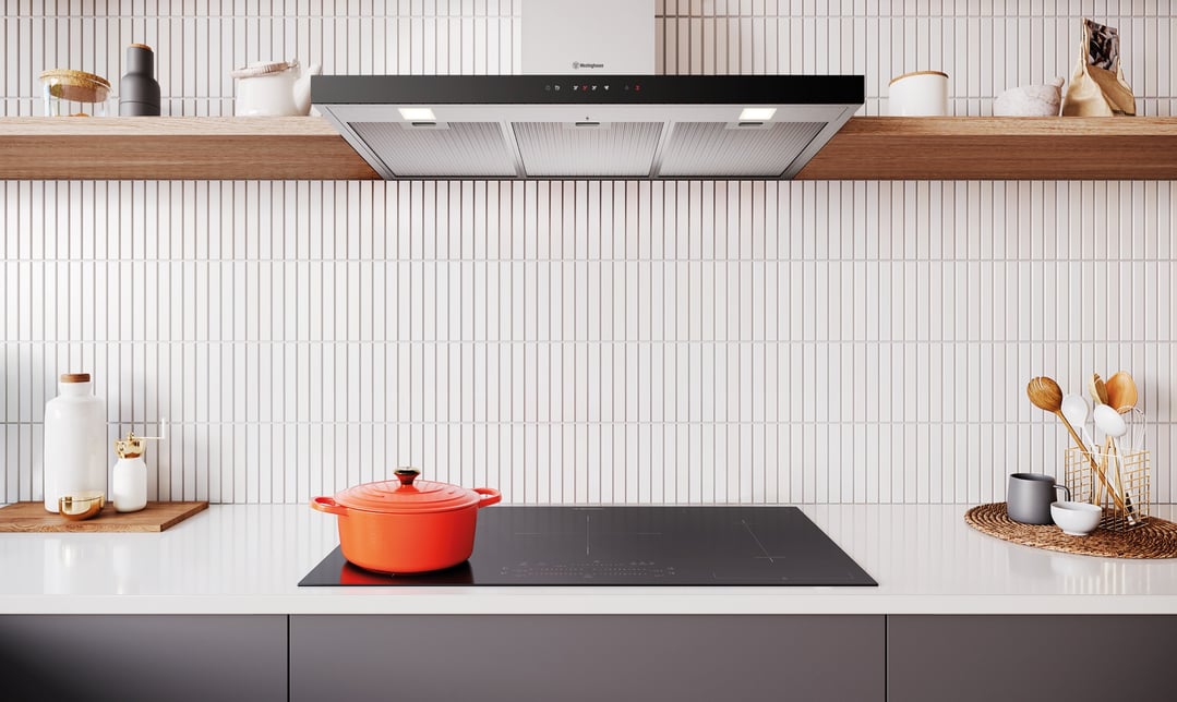 A Westinghouse canopy rangehood installed above a cooktop in a modern kitchen