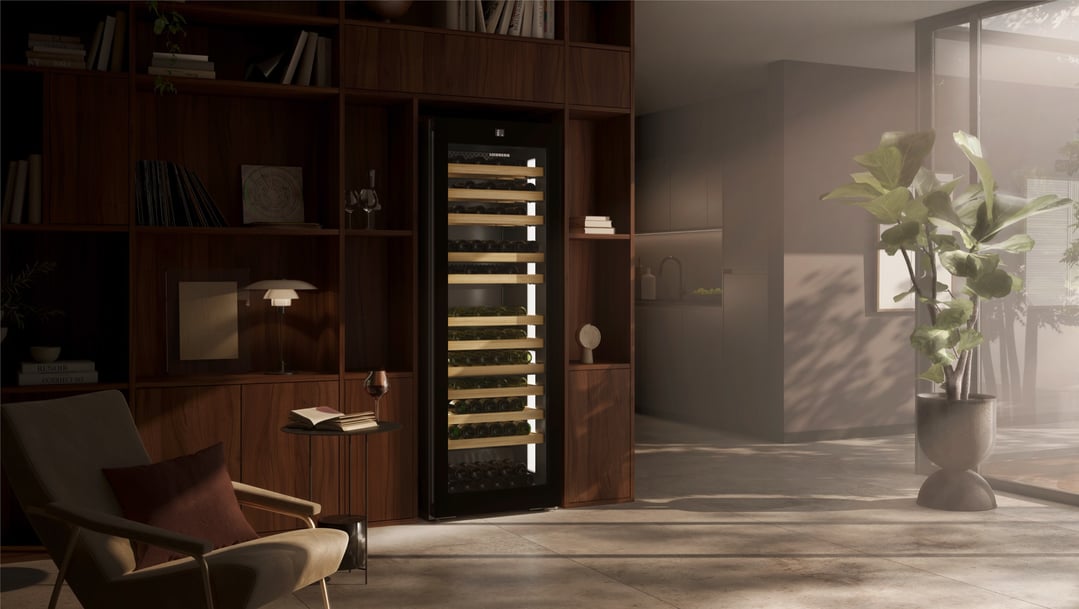 Liebherr wine fridge integrated into a wooden shelving unit in a living room
