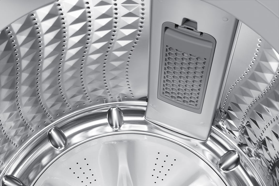 Close-up view inside the drum of a top load washing machine