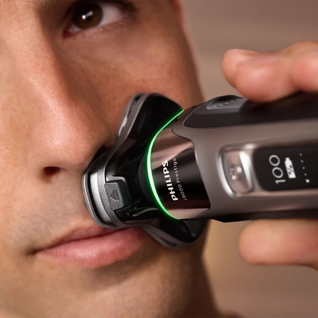 Man shaving his face with a Philips i9000 Prestige electric shaver