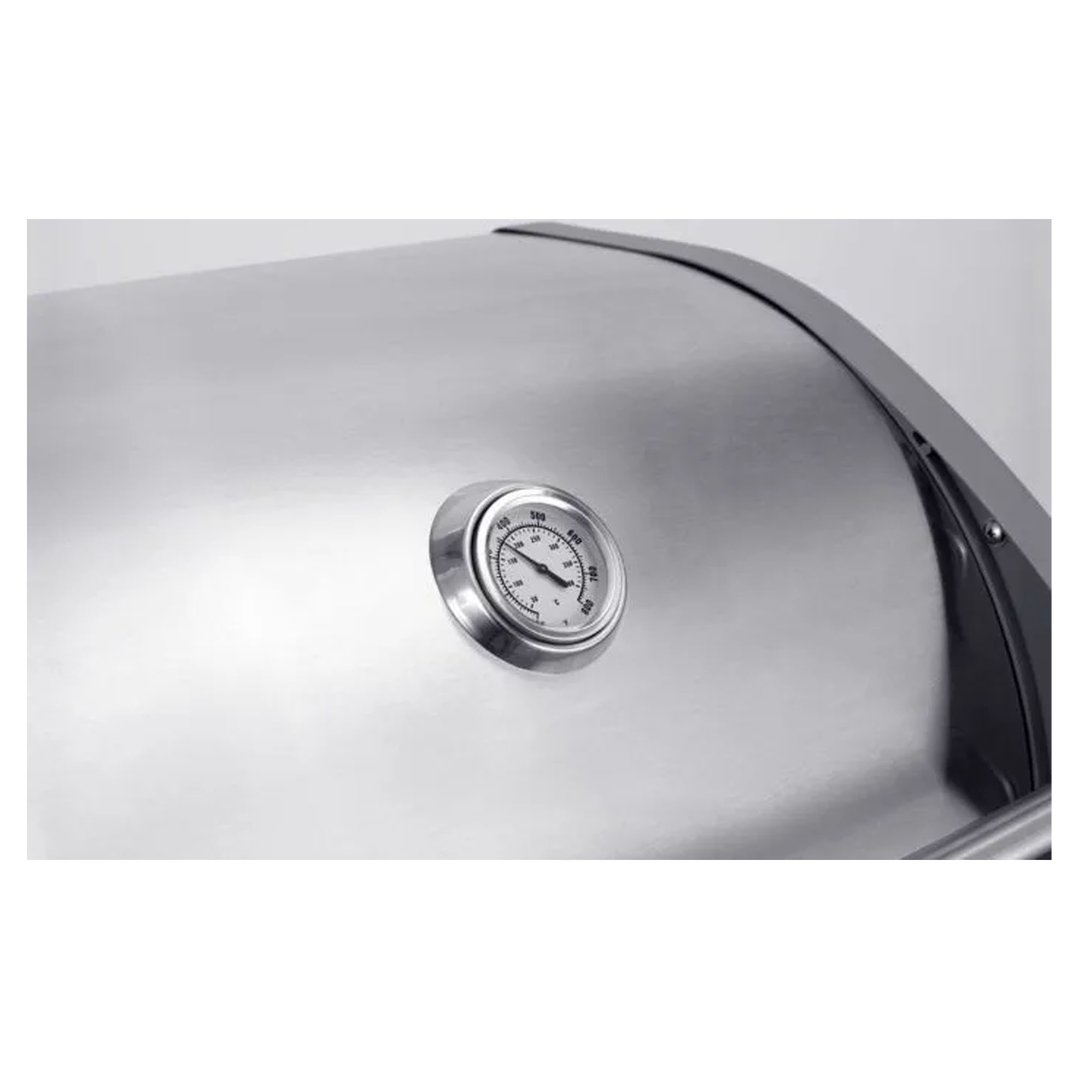 Close up of the temperature gauge on a stainless steel barbeque lid