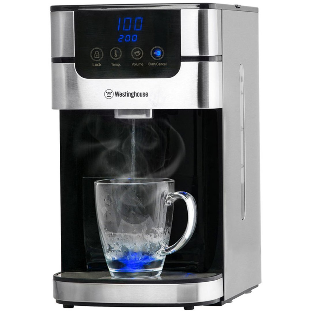 Instant hot water dispenser pouring hot water into a glass mug