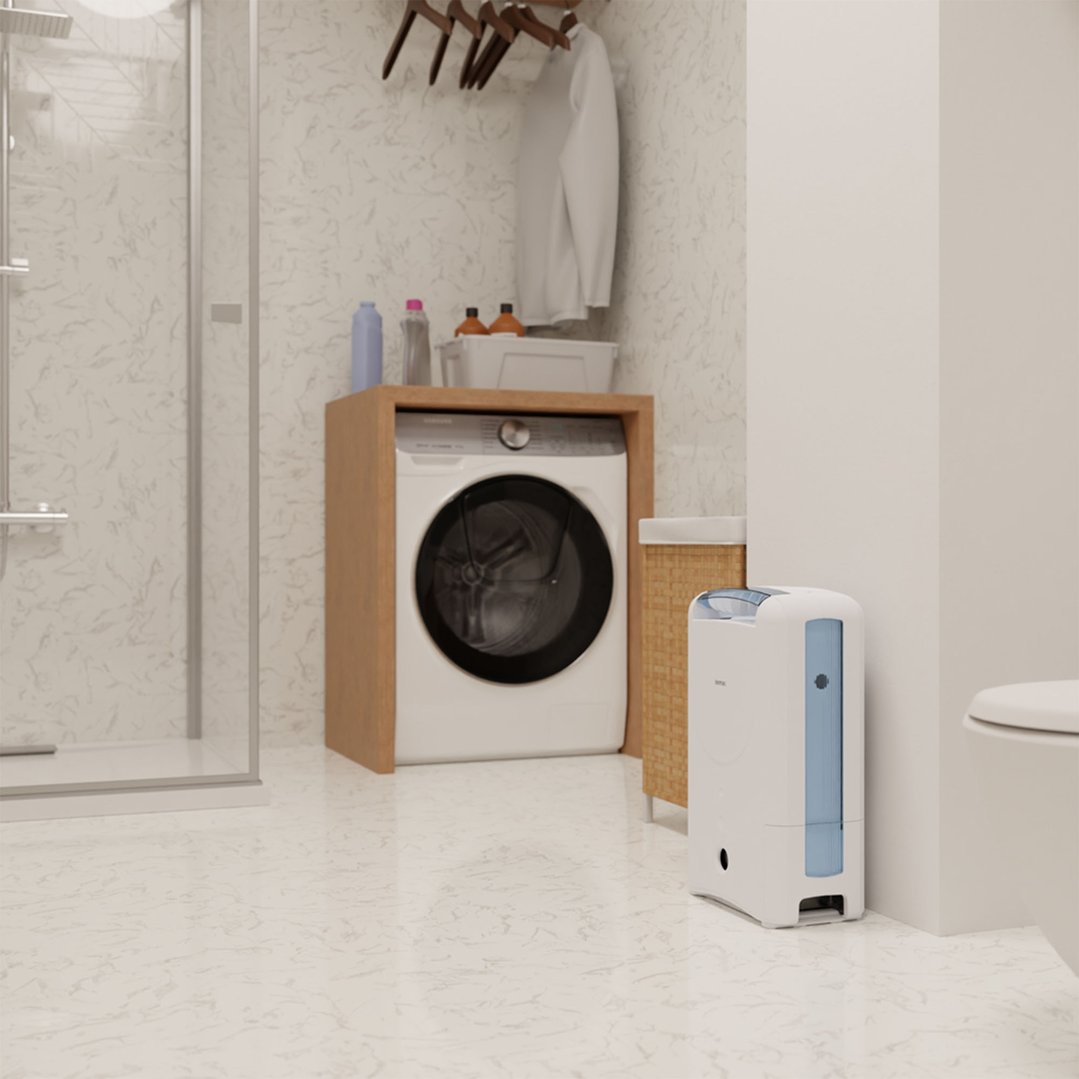 IONMAX dehumidifier in a laundry room with a washing machine and shower