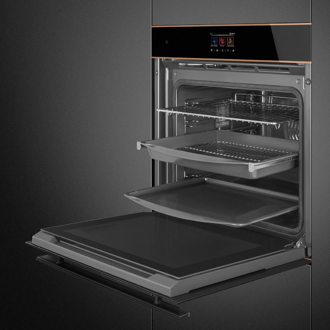 Built-in oven with door open, showing multiple racks and trays inside