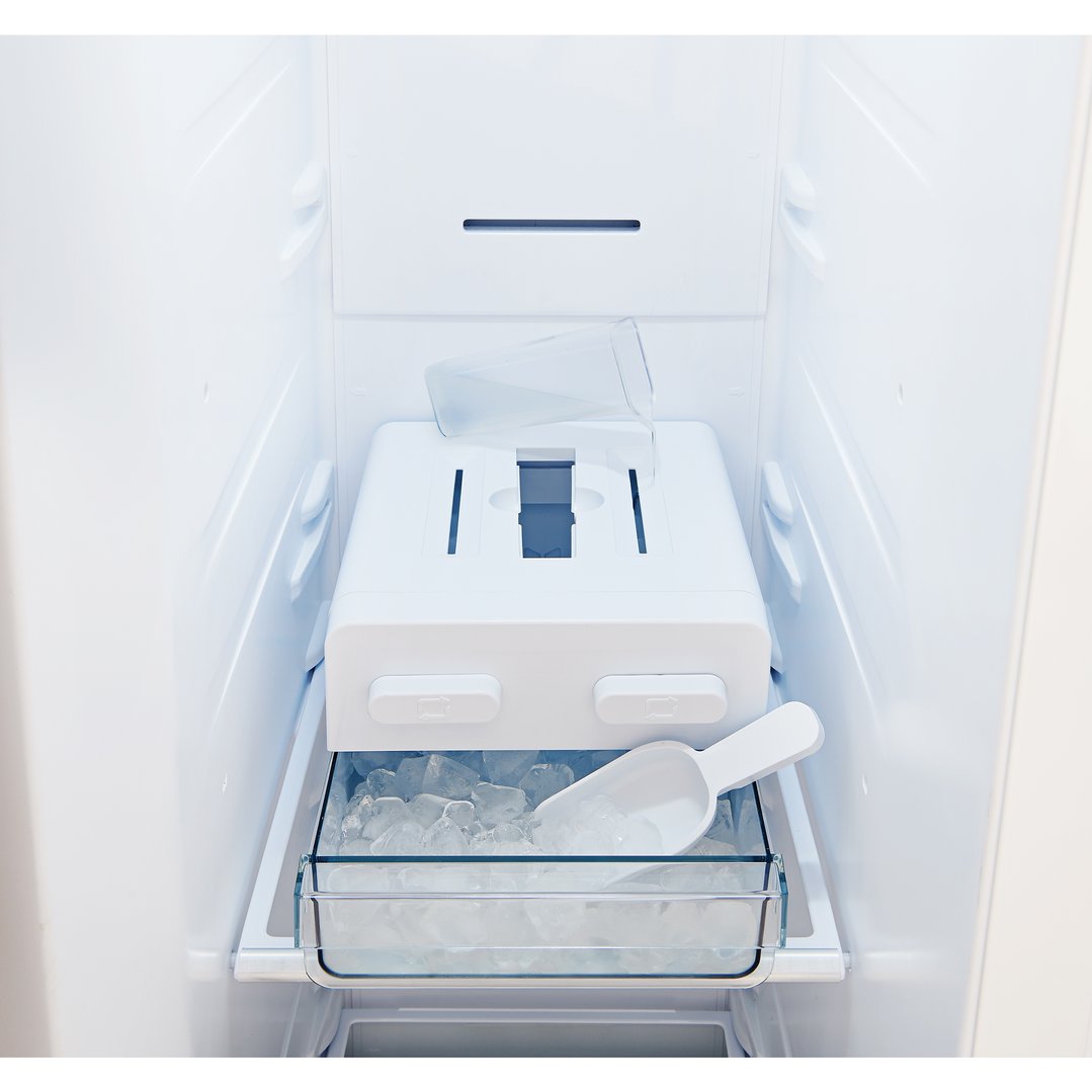 Close up of the ice maker and ice bucket inside a refrigerator