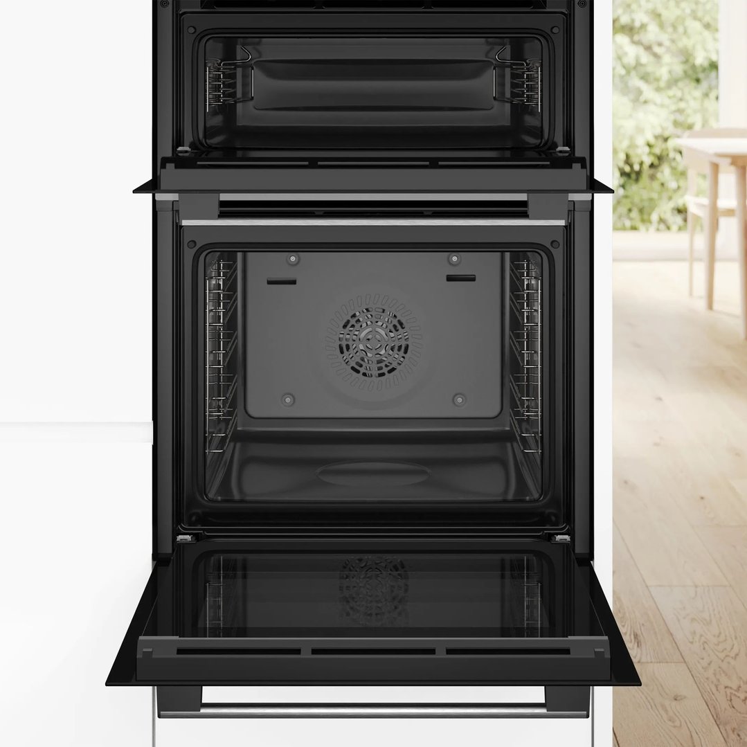Open Bosch built-in double oven in a kitchen setting