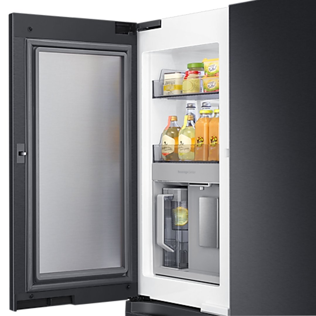 Open black French door refrigerator showing internal beverage center with drinks