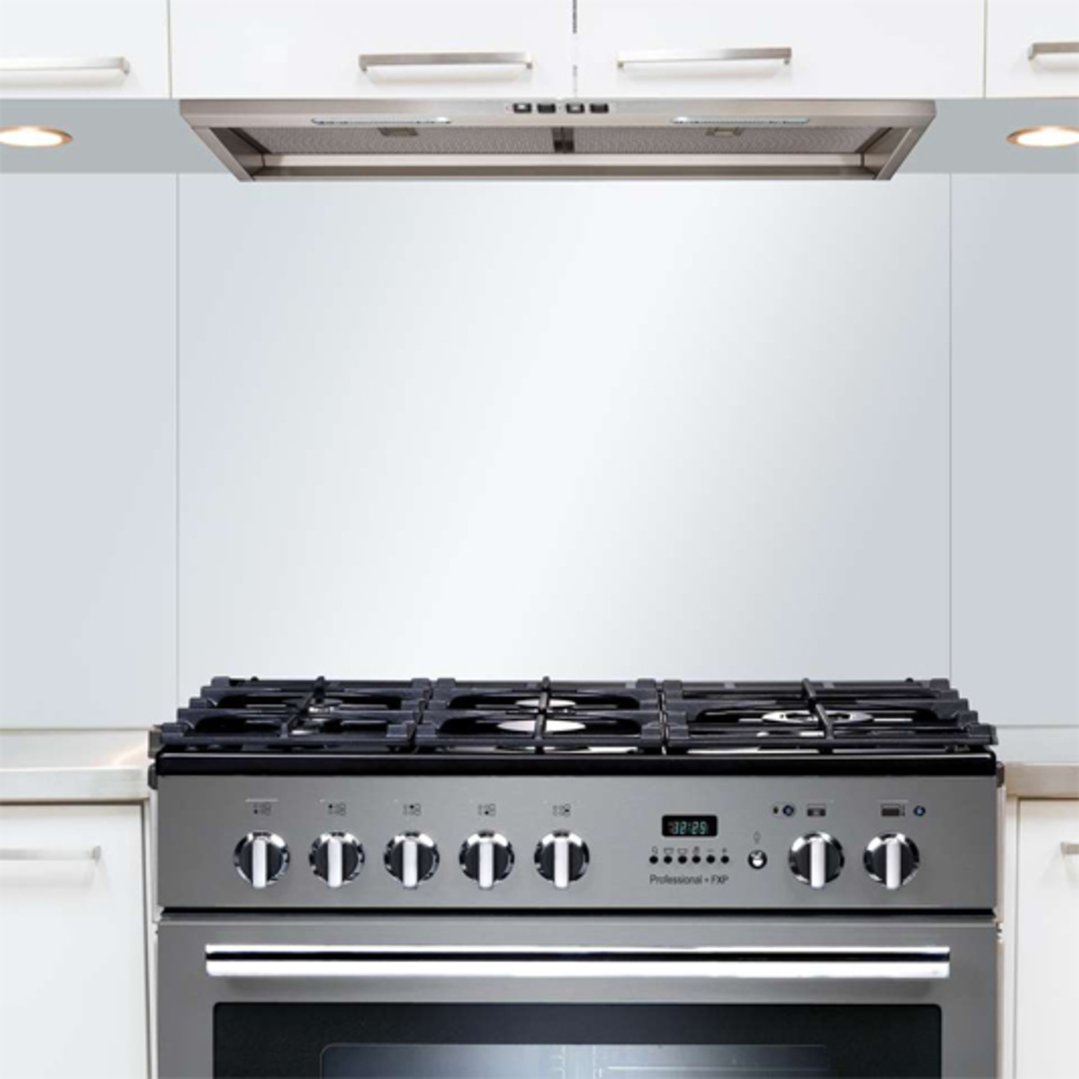 Undermount rangehood installed above a stainless steel oven in a modern kitchen