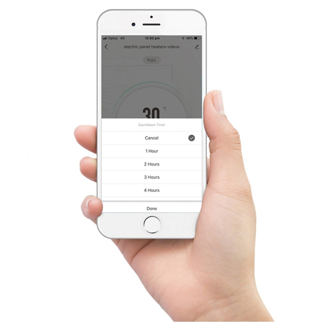 Hand holding a smartphone displaying the electric panel heater's countdown timer