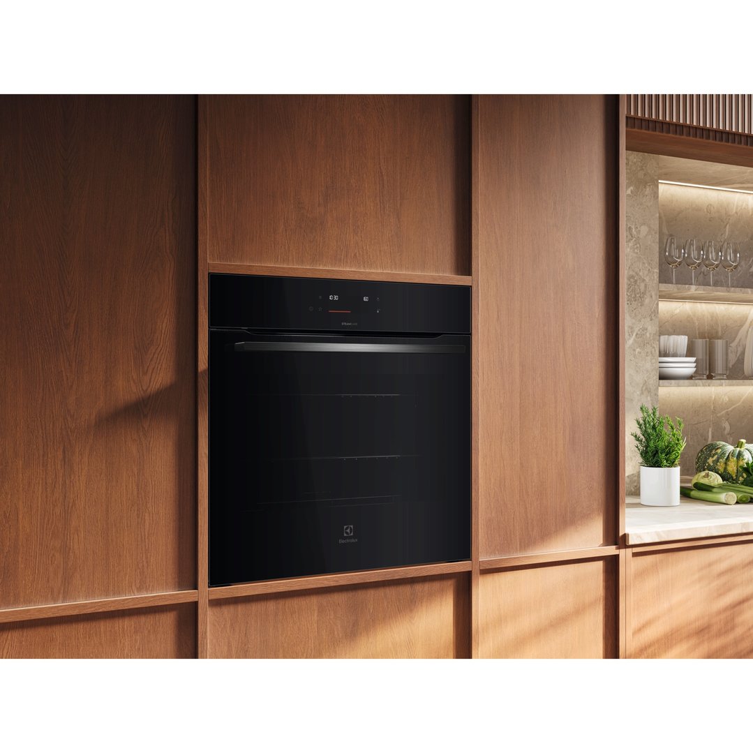 Built-in Electrolux oven in a modern kitchen with wooden cabinetry
