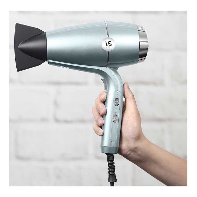Hand holding a VS Sassoon Hydro Smooth Fast Dry hair dryer