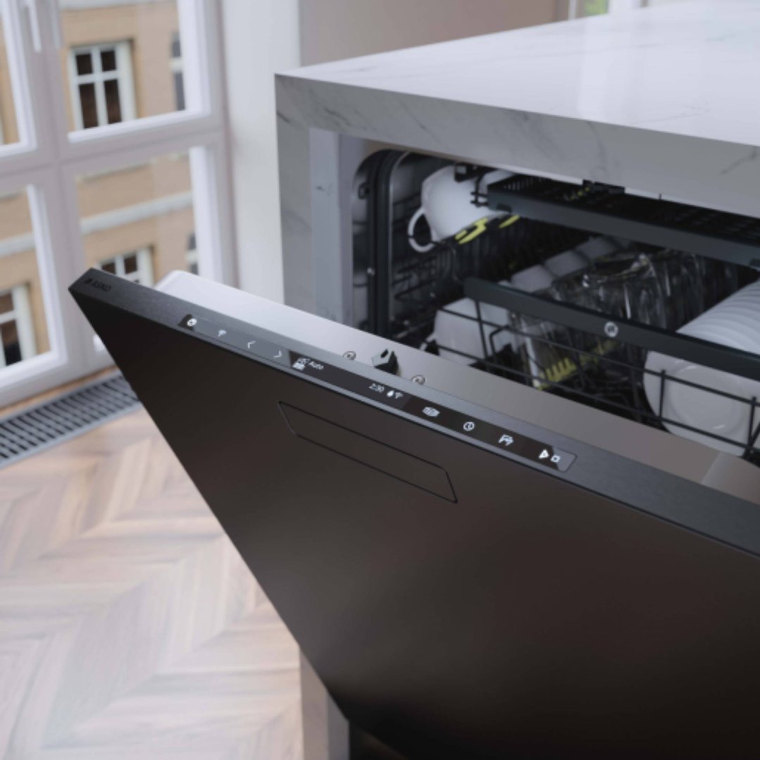 Black steel dishwasher with door ajar, showing dishes inside, in a kitchen