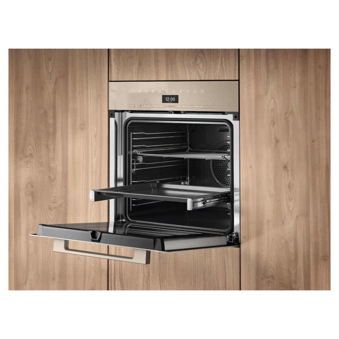 Built-in Miele oven with door open and rack extended in a wooden kitchen