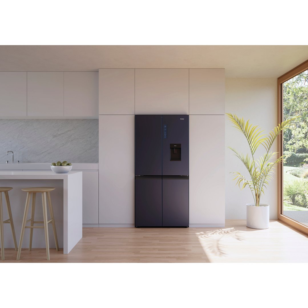 Haier Quad Door Refrigerator Freezer in a modern kitchen with island and stools