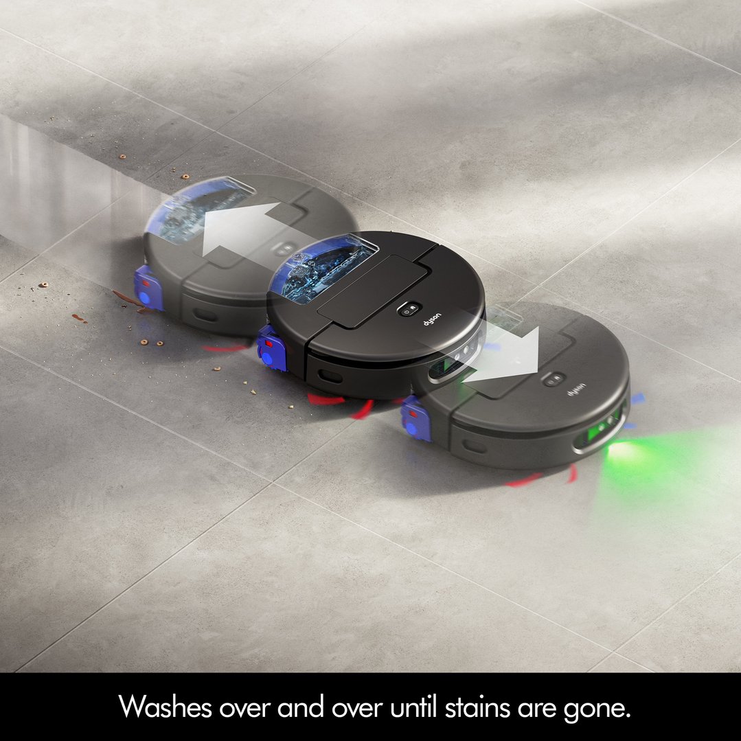 Three Dyson robot vacuum cleaners cleaning a tiled floor with spills and debris