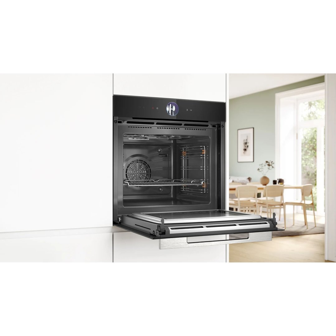 Built-in Bosch oven with open door in a modern kitchen setting