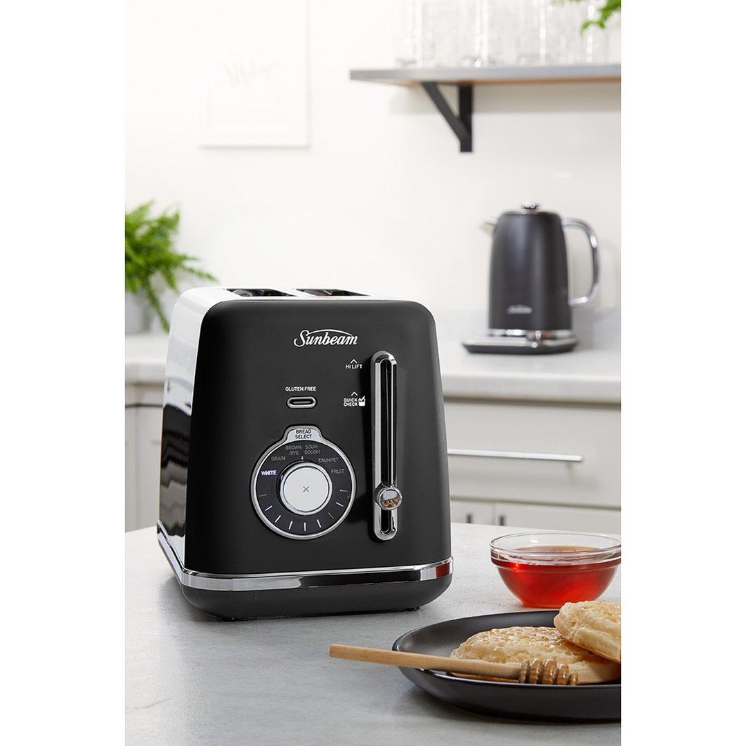 Black Sunbeam Alinea Select 2 Slice Toaster on a kitchen counter with food