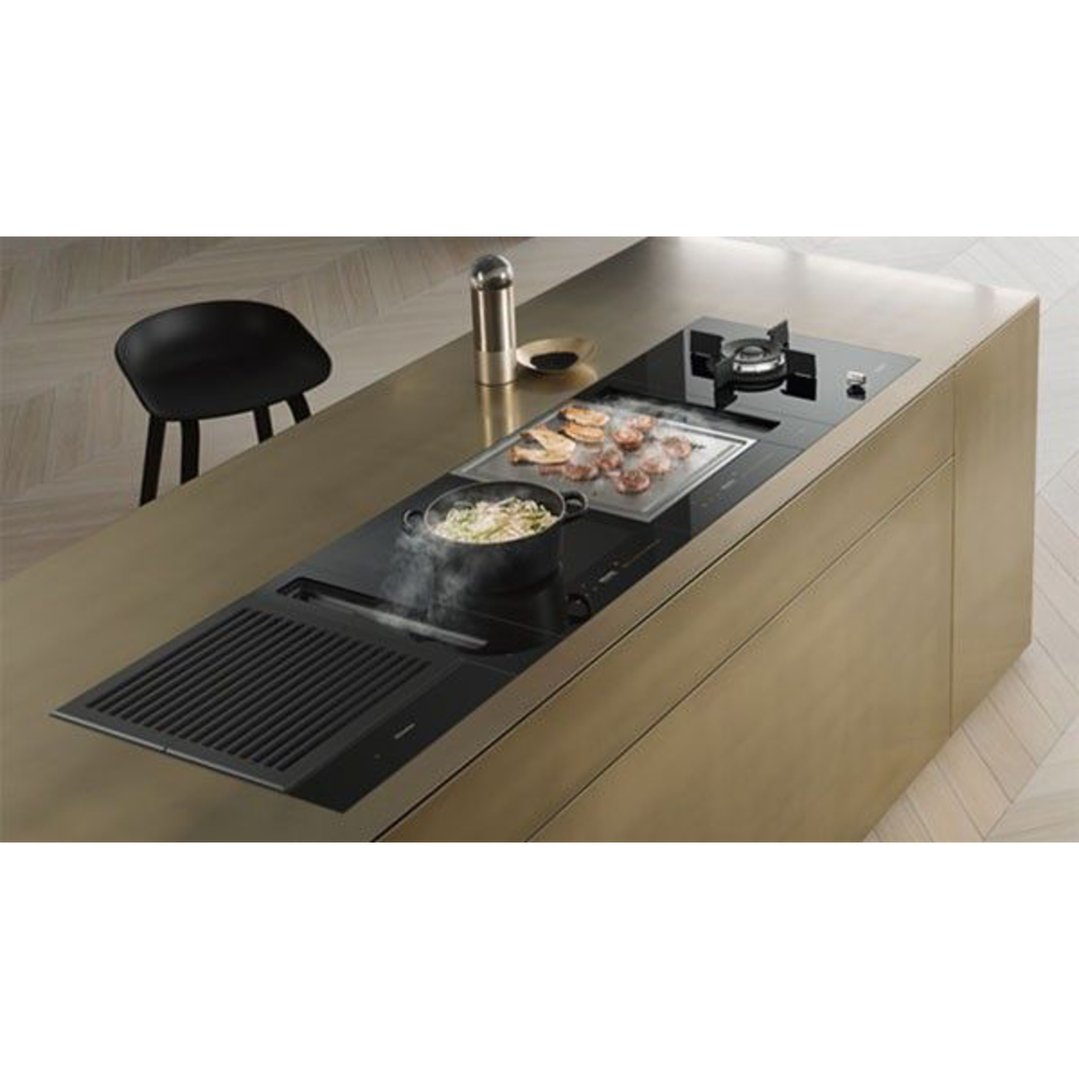 Miele induction combi set teppanyaki cooktop in a modern kitchen island setting