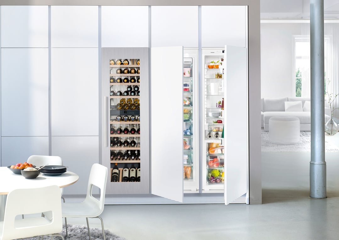 Built-in wine cabinet and refrigerator in a modern kitchen with dining area