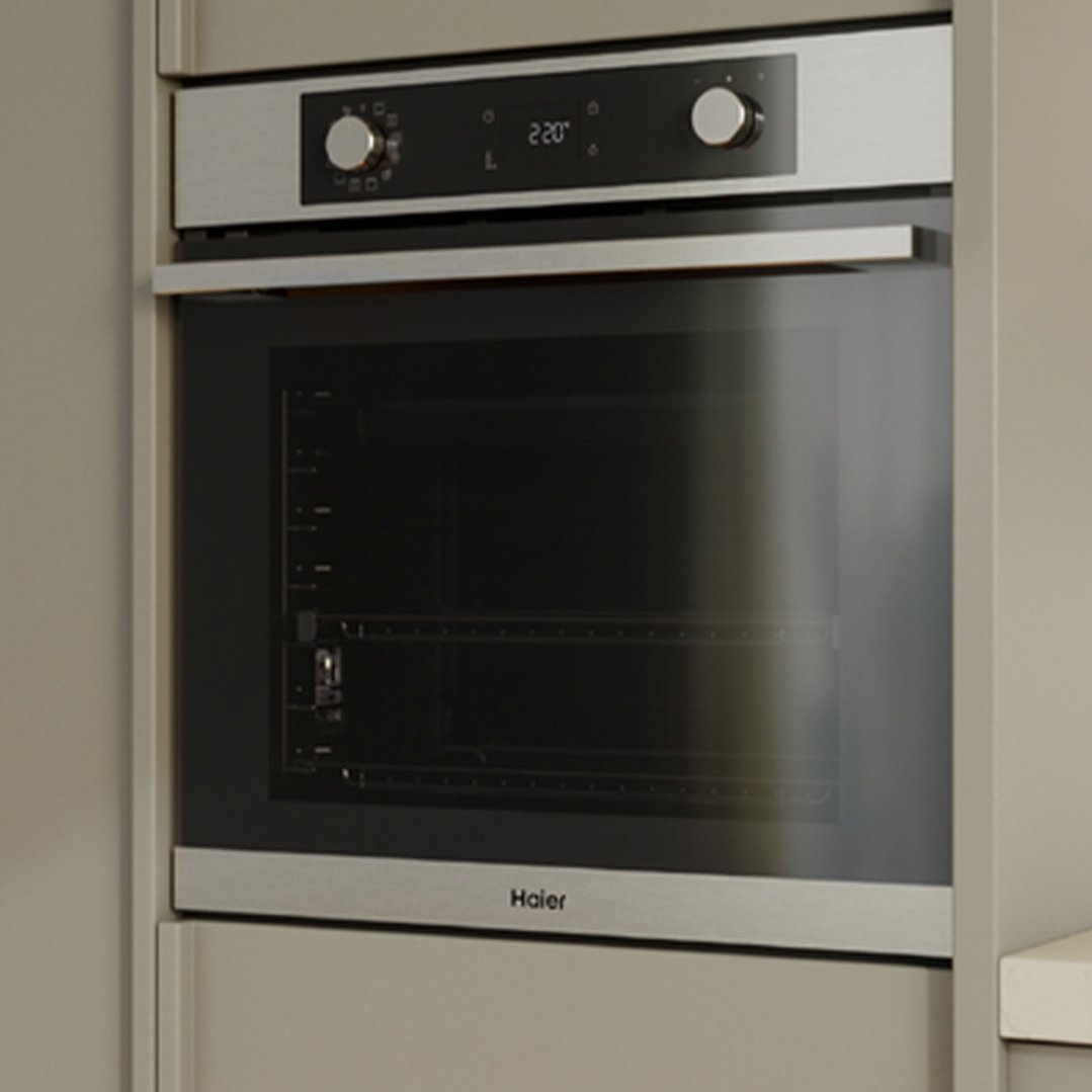 Built-in oven with stainless steel trim and black glass door in a kitchen