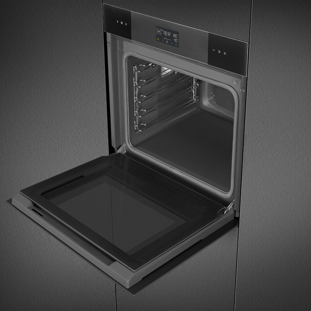 Built-in black SMEG oven with door open in a dark kitchen setting