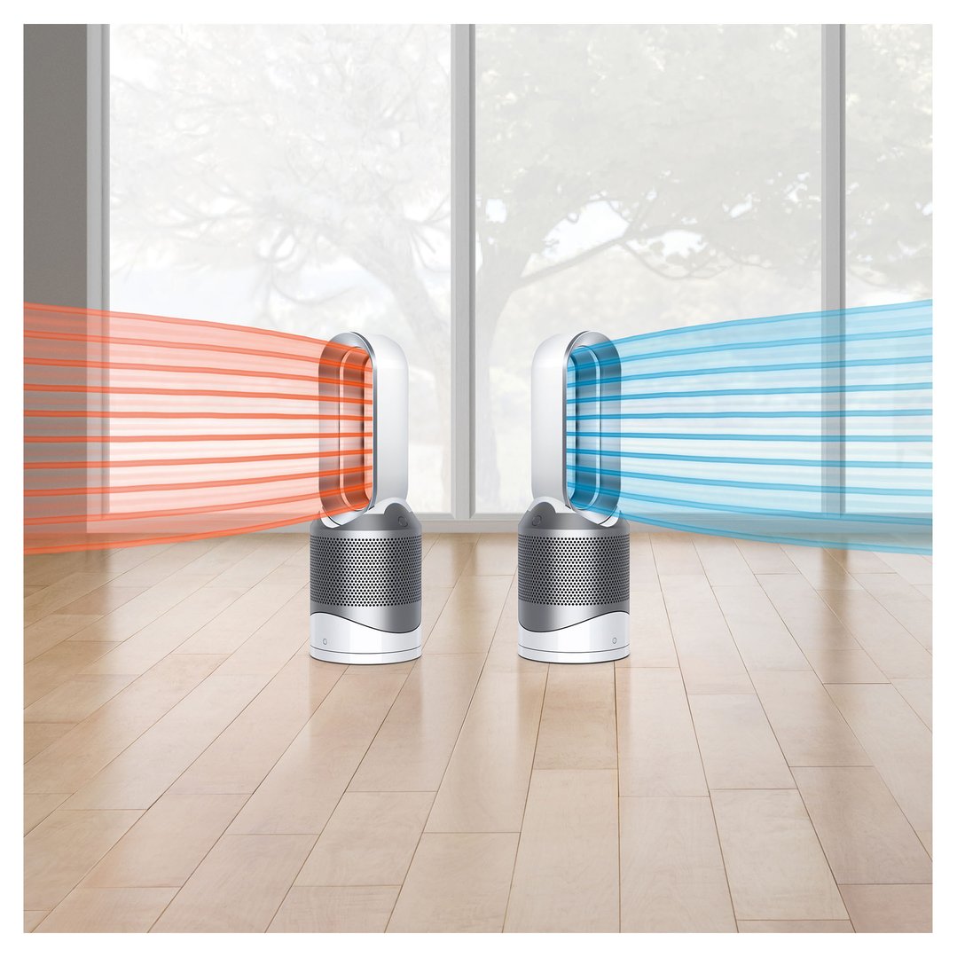 Two Dyson air purifiers emitting hot and cool air in a room