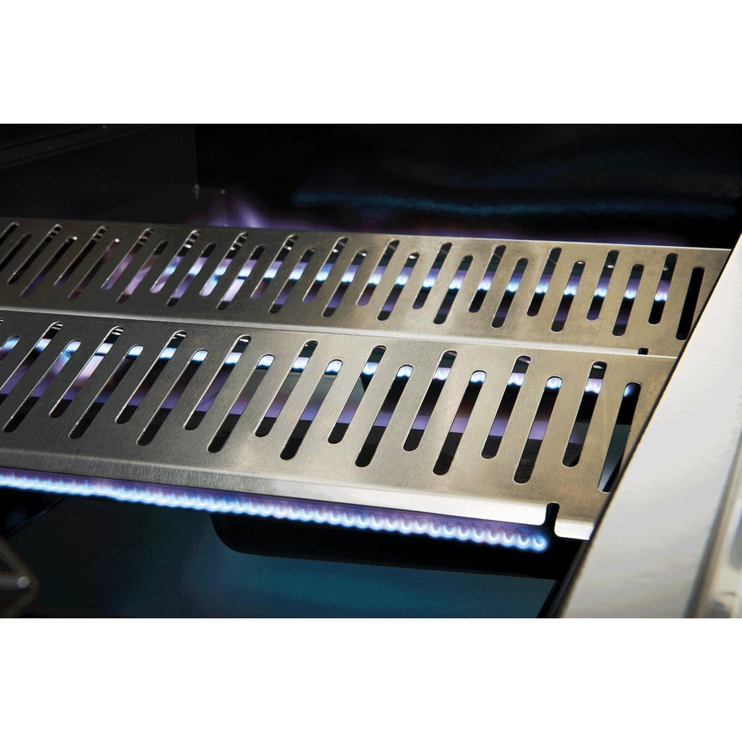 Close up of the lit burners and flame tamers inside a barbecue