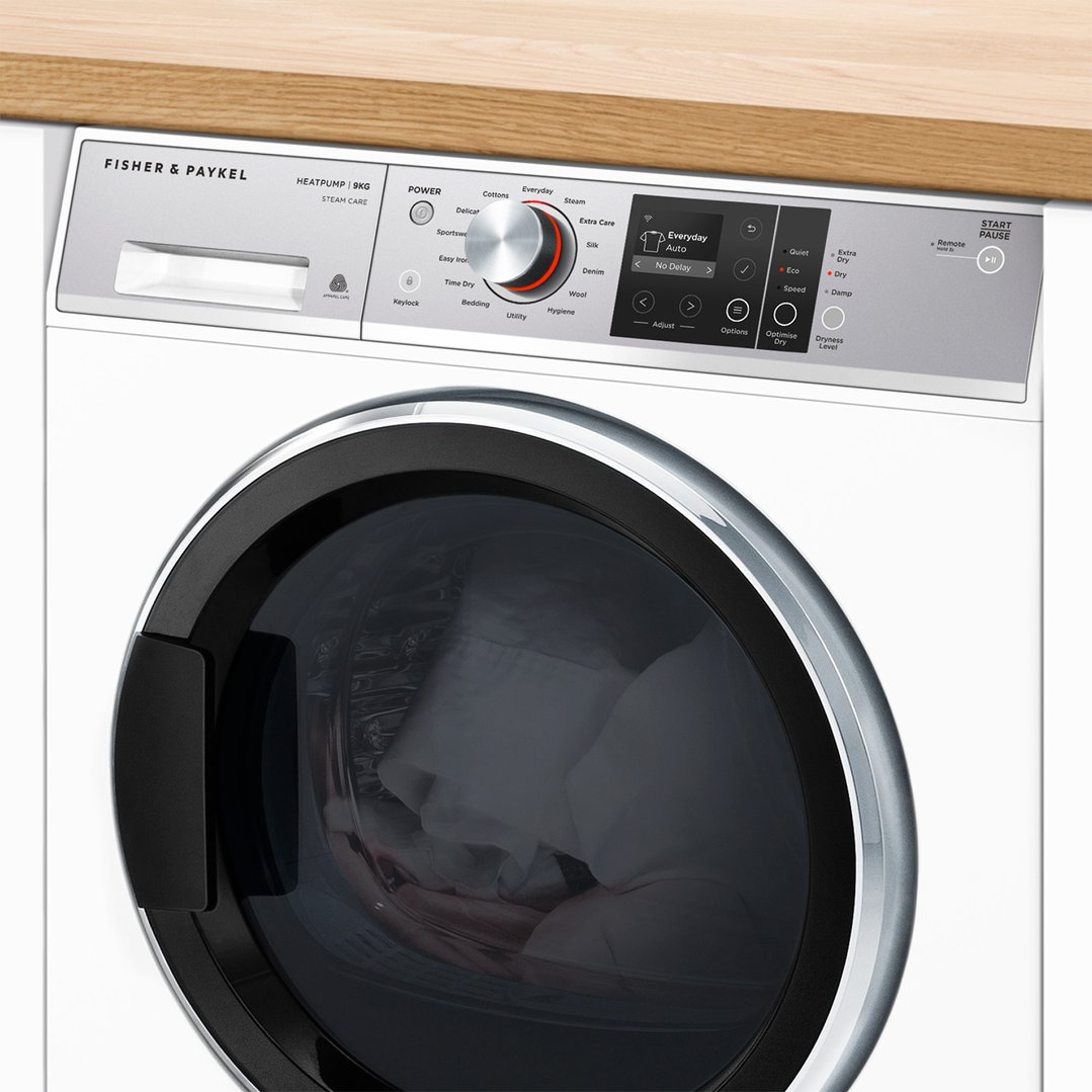 A white Fisher & Paykel dryer with a black door and control panel