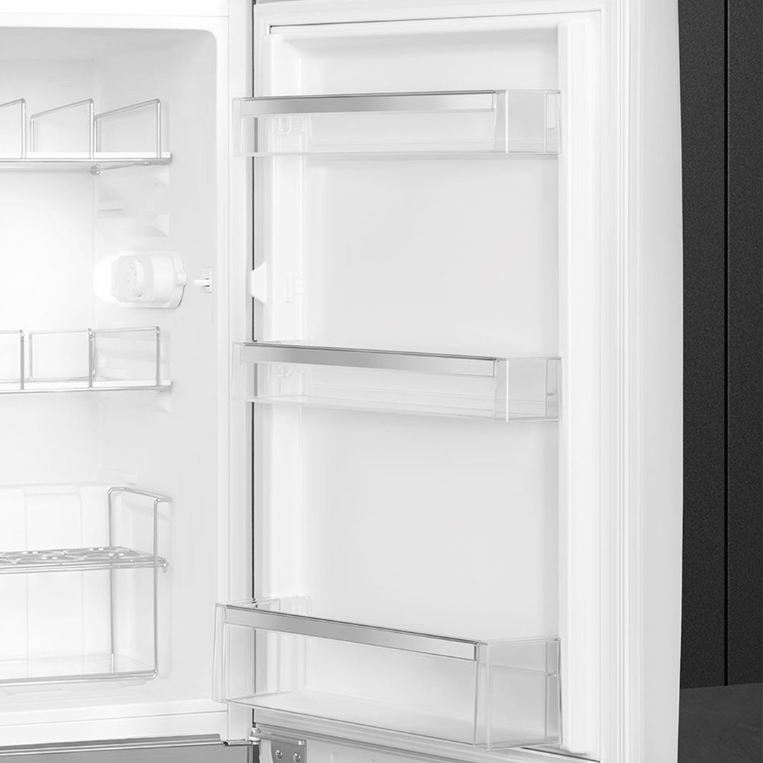 Interior view of a white SMEG refrigerator with clear door shelves