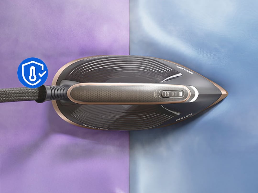 Philips PerfectCare Steam Generator iron on a purple and blue fabric
