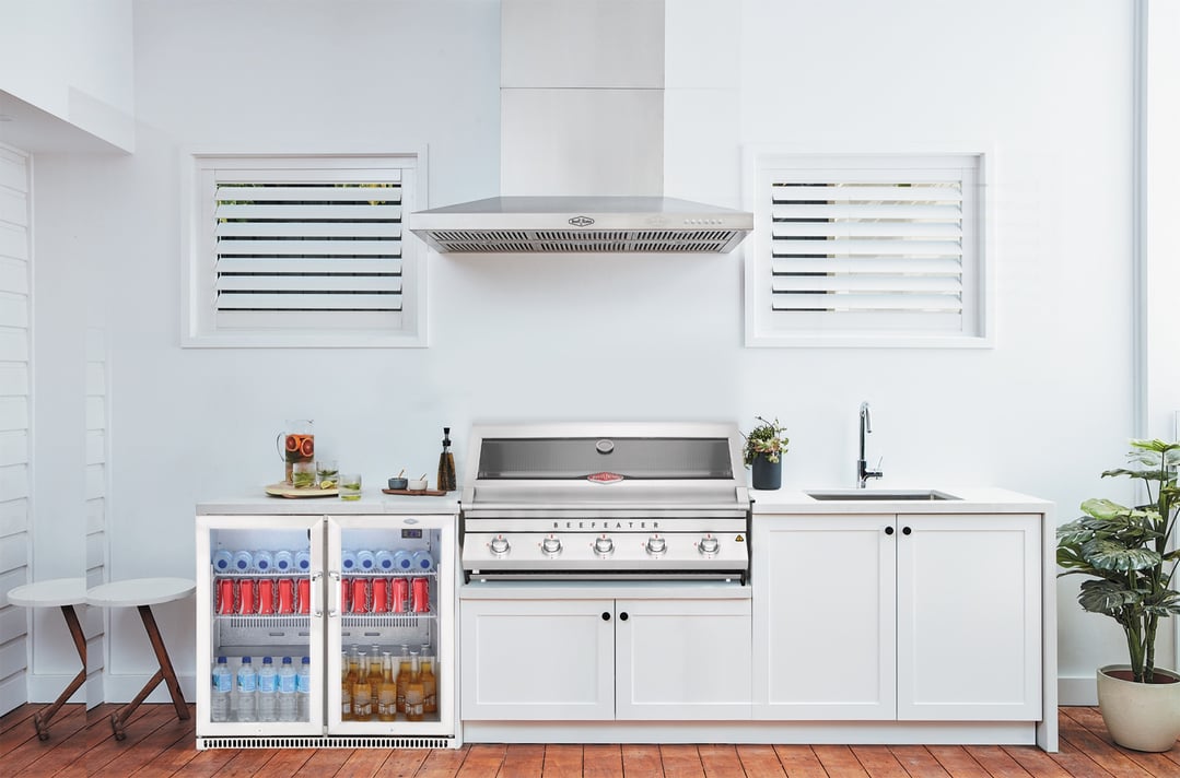 Beefeater rangehood and grill in an outdoor kitchen with drinks fridge