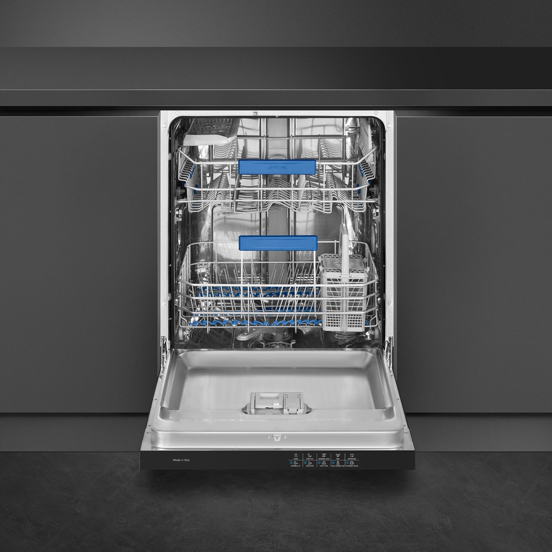 Open dishwasher with blue racks in a dark kitchen setting