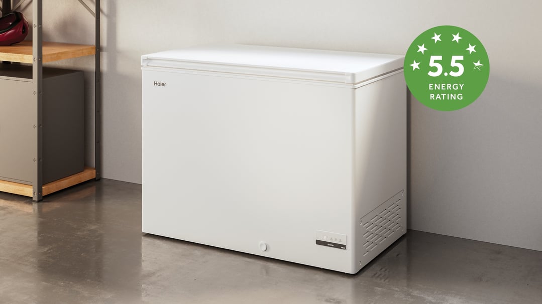 White chest freezer with 5.5 energy rating in a garage setting